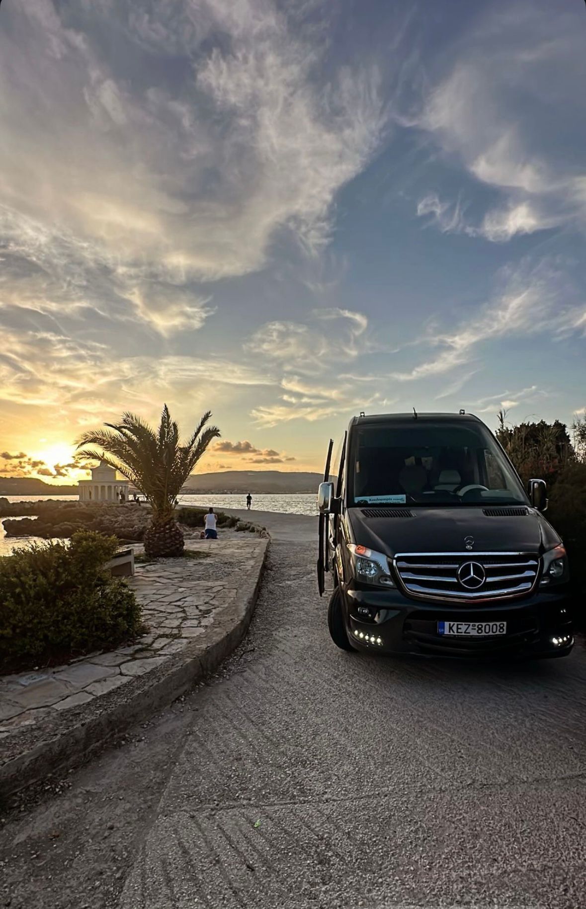 A luxury shuttle van at the airport ready to transport guests to Breathe the Blue Wellness Retreat, with a welcoming, serene atmosphere.